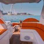 Outdoor lounge of the Oryx yacht with Ain Dubai view during a Dubai yacht rental cruise