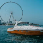 36 ft Oryx yacht sailing near Ain Dubai wheel during a Dubai yacht rental fishing trip